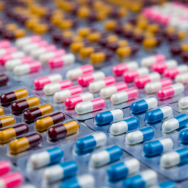 Pharmaceuticals Assorted antibiotic capsules symbolizing pharmaceutical manufacturing supported by liquid nitrogen generators